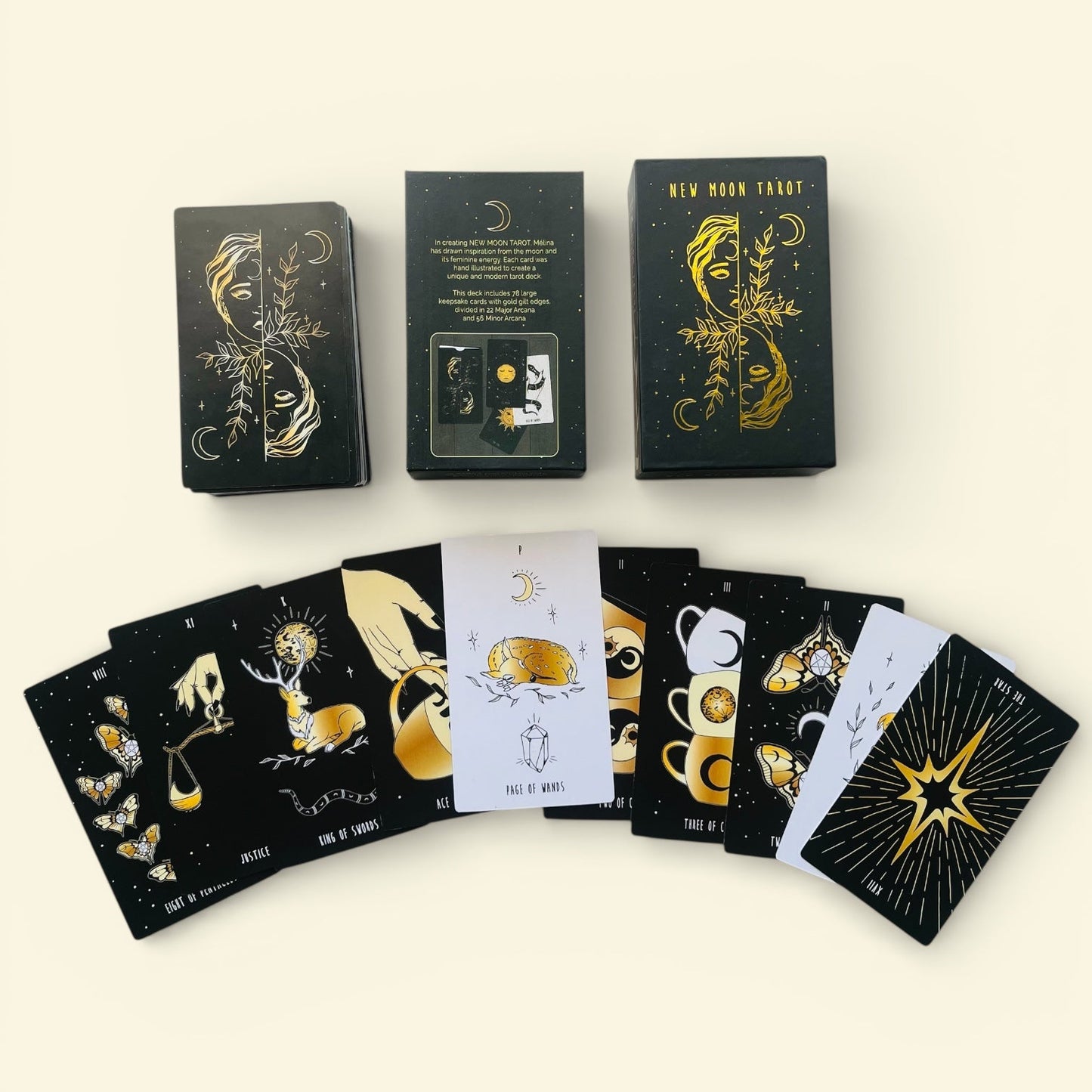 Set of tarot cards with black and gold designs on a white background